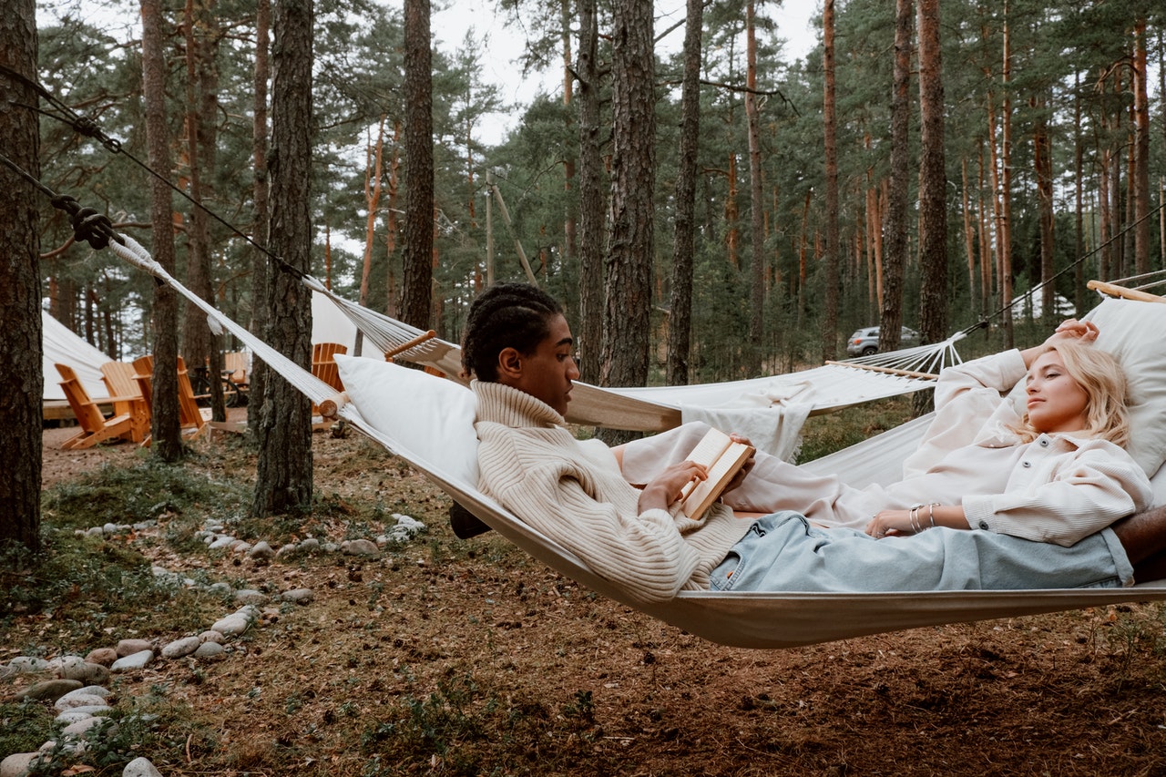 Man and women sitting on a hammock