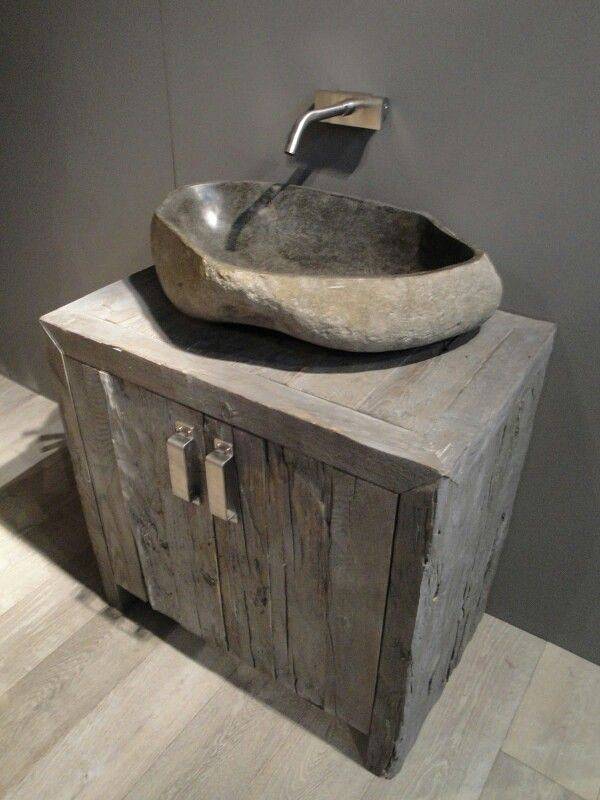 A stone sink stands in the bathroom